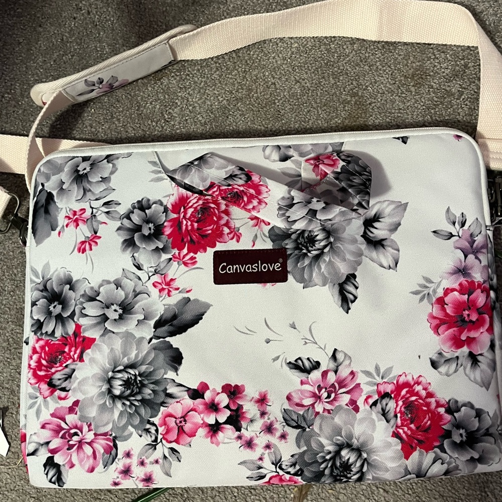Floral 15 inch laptop carry case with detachable strap.
